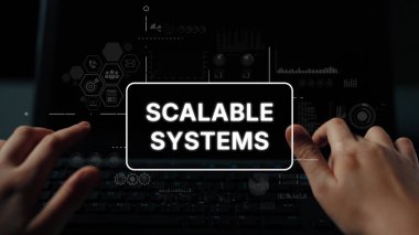 Hands on Keyboard with Scalable Systems Interface Displayed on Laptop Screen in Dark Environment. Asymptotic smart data analytic.