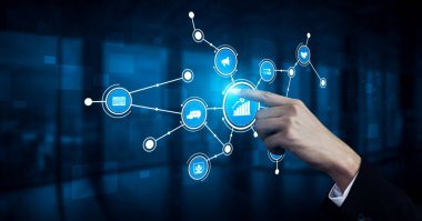 A businessman engages with a dynamic digital interface showcasing data visualizations, ideal for themes of innovation, analytics, and modern technology in a corporate environment. Tessel