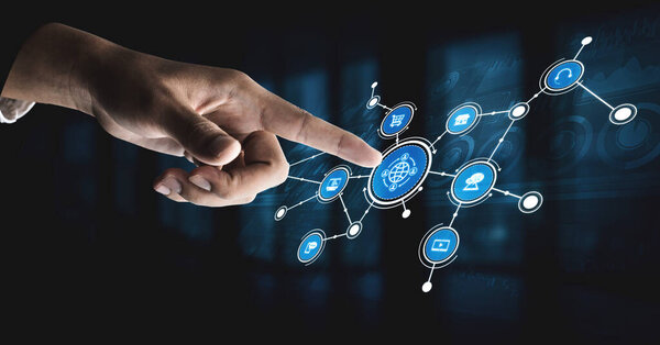 A close-up of a hand pointing towards digital connectivity icons that represent global technology concepts, set against a dark backdrop for a striking visual impact. Tessel