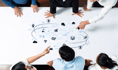 A diverse business team collaborates on a digital strategy, analyzing visual data over a table in a modern office, emphasizing teamwork and innovative solutions. Trope