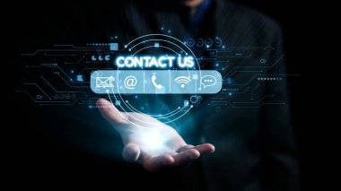 A professional hand showcases interactive icons representing contact options such as email, phone, and social media, emphasizing digital connectivity in modern business environments. Qubit