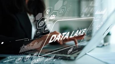 Professional Working on Laptop with Data Lake Concept and Digital Graphical Elements in Modern Office Environment. Asymptotic smart data analytic.