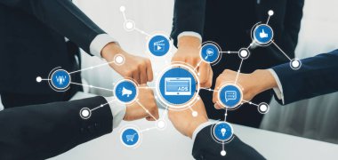 This image showcases the essence of teamwork in advertising strategies, with hands uniting around digital icons that symbolize communication, success, and innovation. Amity