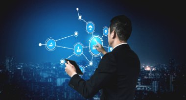 A businessman engages with a digital network, depicting modern technology and data analysis amid a vibrant urban skyline, symbolizing innovation and connectivity. Tessel