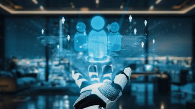 Robotik bir el, parlak bir ofis alanında insan figürlerinin parlayan holografik bir temsilini sergiliyor. Geceleri canlı bir şehirde gelişmiş teknolojiyi vurguluyor. Auvana