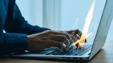 Close-up of Business Professional Typing on Laptop with Digital Analytics and Graphs Emanating from Screen in Modern Workspace Environment. Qubit.