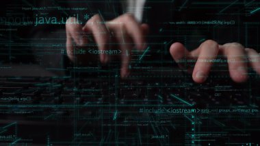 A visual representation of coding and software development featuring hands on a keyboard with luminous code elements, emphasizing the digital workspace and technology. Xenic