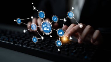 Hands are typing on a keyboard, surrounded by digital network icons symbolizing modern technology and communication in a business office setting. Tessel