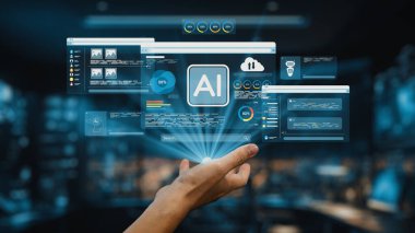Yapay zeka analizi ve veri görsellemesinin holografik görüntüleriyle etkileşime giren bir el, dijital çalışma alanındaki teknoloji ve insan ilişkilerinin kesişimini vurguluyor. Auvana