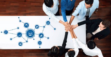 A diverse group of professionals collaborates in a modern office, symbolizing teamwork and analytics with technology icons, promoting insights and growth. Amity