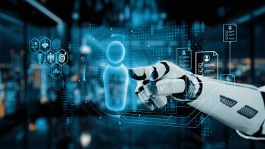 Bir robot el, parlak bir çalışma alanında dijital bir arayüzle birleşerek, yenilikleri somutlaştırır ve yapay zeka ve veri görselleştirme teknolojilerinin entegrasyonunu sağlar. Auvana