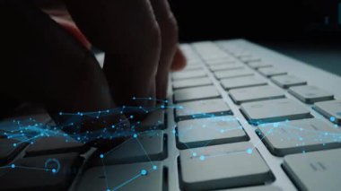 A close-up view of a finger pressing keys on a keyboard, surrounded by digital data visuals and graphs, representing technology, analytics, and modern business innovation. Xenic